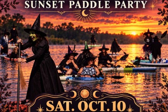 Halloween-themed kayak event poster with witches and sunset over a river.